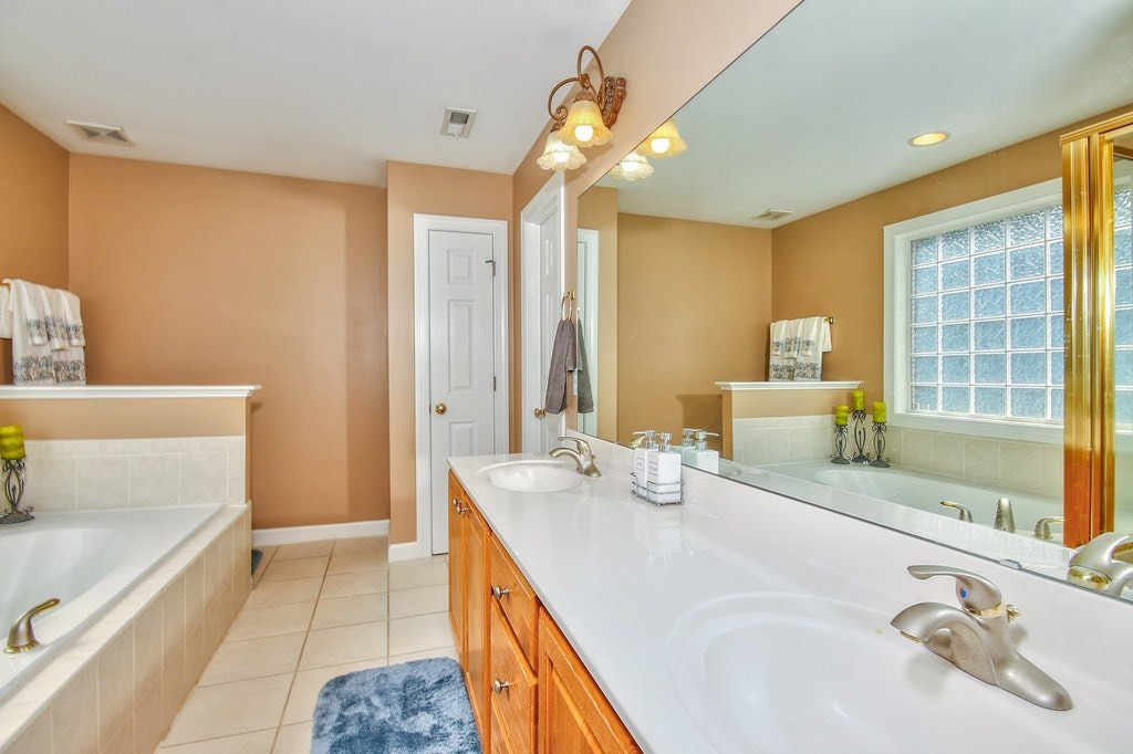 3924 Lauriston Road Raleigh, NC 27616 - Photo 14 of 25 Your master en suite features a double vanity so no fighting over counter space while getting ready to go out for the day! Separate shower and a linen closet for additional storage. Master Bath