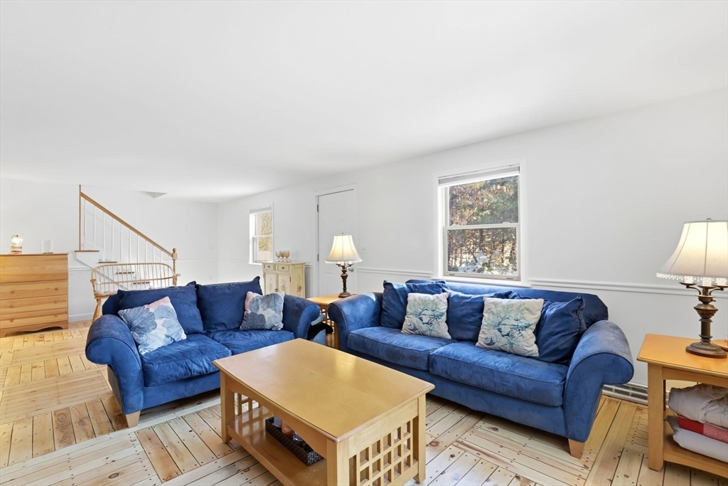 40 Fosdick Road Carver, MA 02330 - Photo 11 of 27 a living room with white couches and a couch with wooden floor