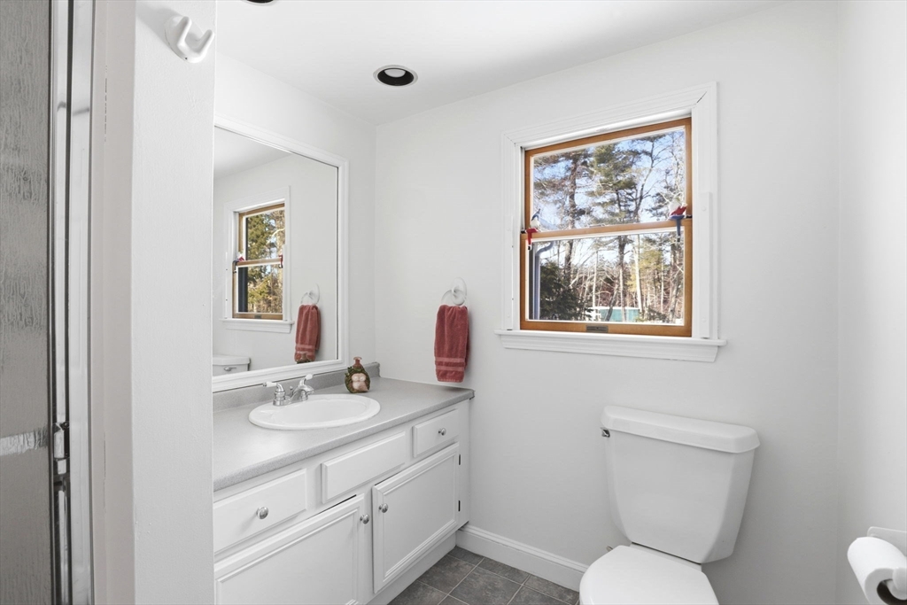 40 Fosdick Road Carver, MA 02330 - Photo 12 of 27 a bathroom with a toilet sink and mirror