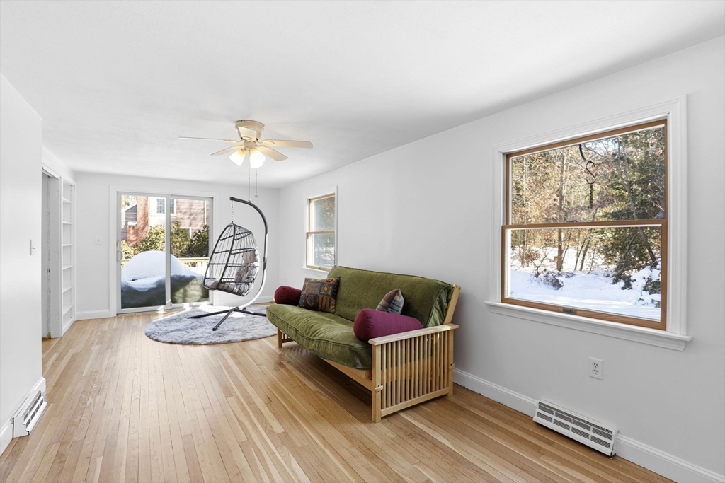 40 Fosdick Road Carver, MA 02330 - Photo 13 of 27 a living room with furniture and a large window with wooden floor