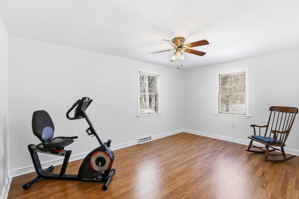 40 Fosdick Road Carver, MA 02330 - Photo 14 of 27 a room with gym equipment and wooden floor