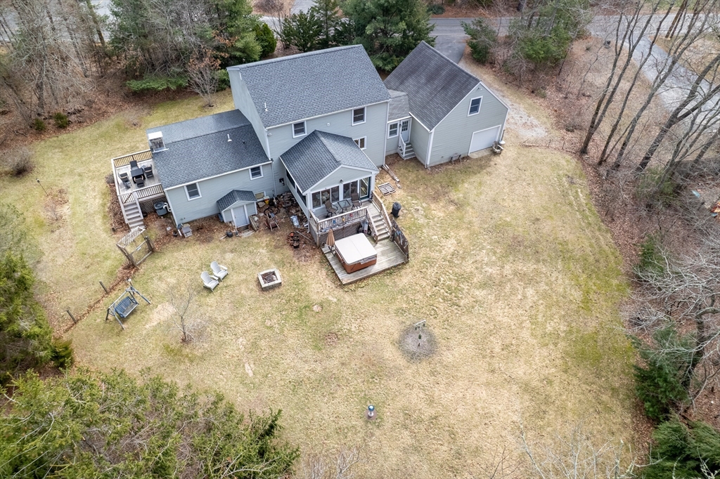 40 Fosdick Road Carver, MA 02330 - Photo 22 of 27 an aerial view of a house with yard and trees