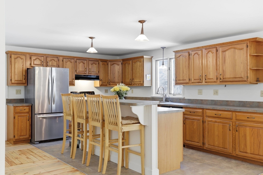40 Fosdick Road Carver, MA 02330 - Photo 4 of 27 a kitchen with stainless steel appliances a refrigerator sink and cabinets