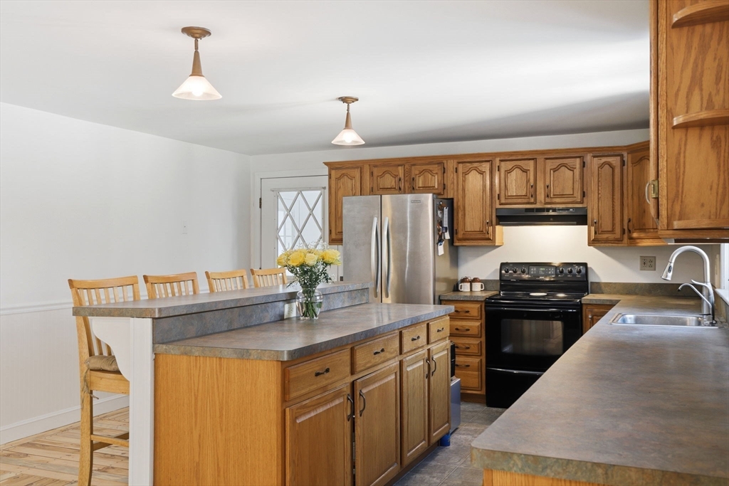 40 Fosdick Road Carver, MA 02330 - Photo 5 of 27 a kitchen with granite countertop a sink stainless steel appliances and cabinets