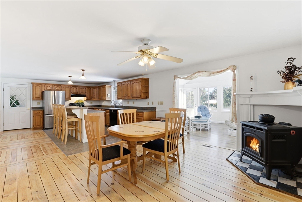 40 Fosdick Road Carver, MA 02330 - Photo 6 of 27 a view of a dining room with furniture and wooden floor