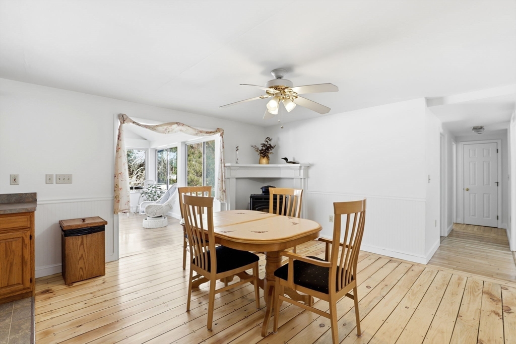 40 Fosdick Road Carver, MA 02330 - Photo 7 of 27 a view of a dining room with furniture a chandelier and wooden floor