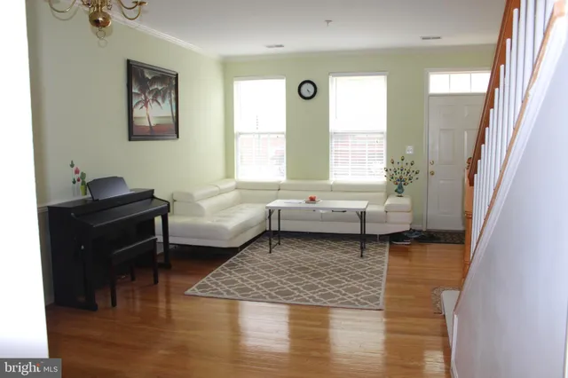 a living room with furniture and a rug