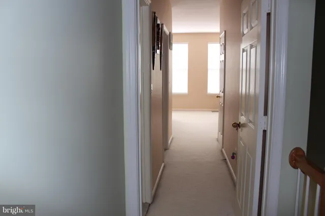 a view of a bathroom from a hallway