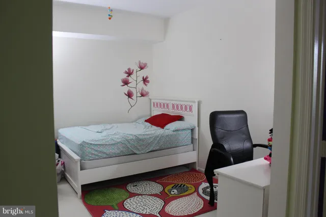 a bedroom with a bed and cabinets