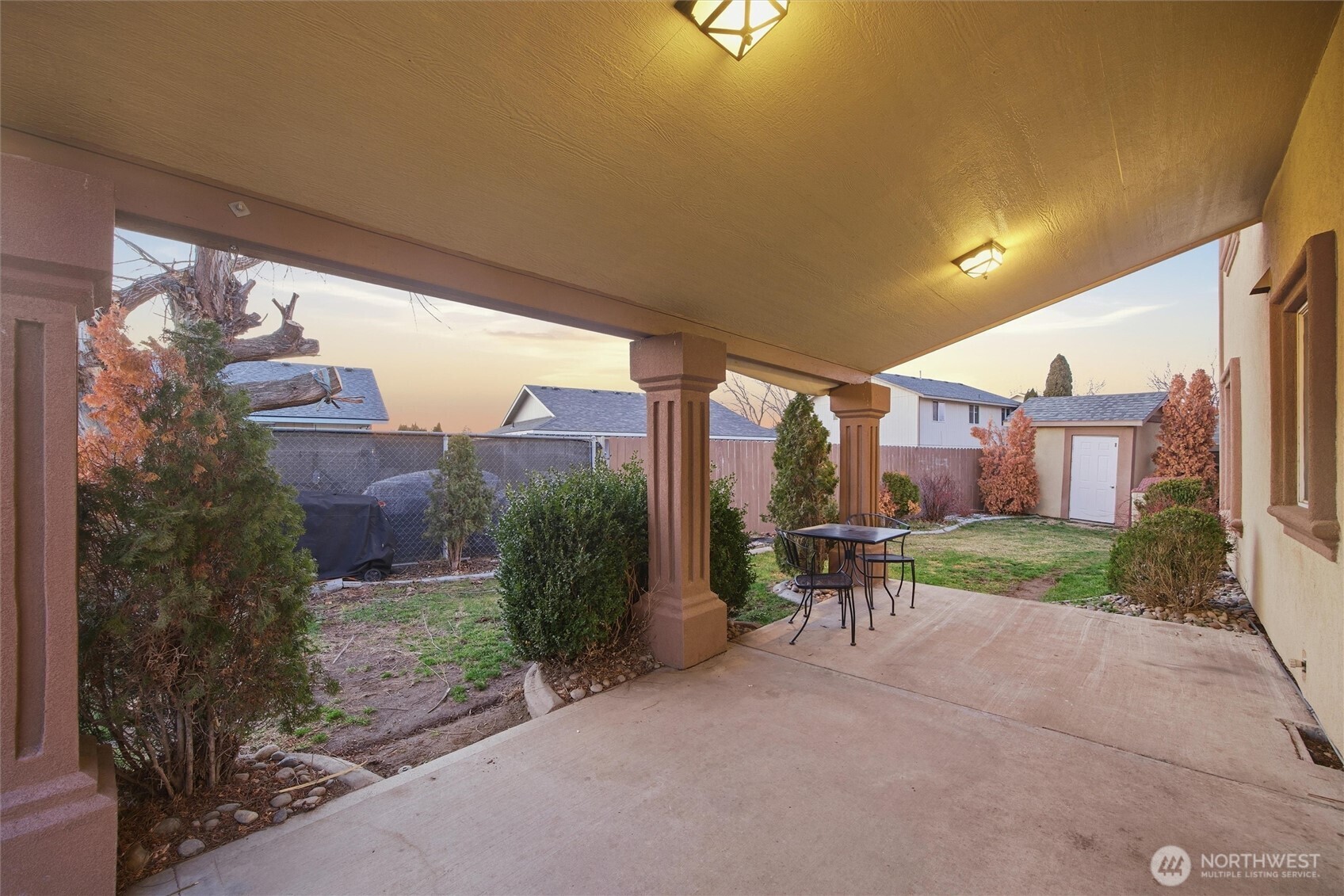 5008 Polo Lane Pasco, WA 99301 - Photo 2 of 26 a view of a patio with a table and chairs and potted plants
