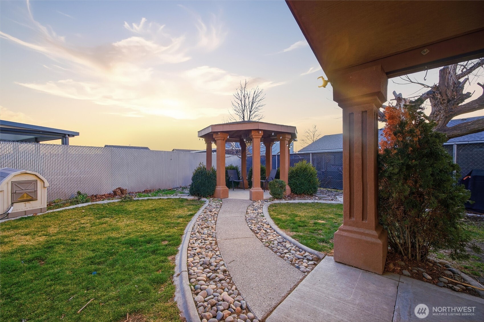 5008 Polo Lane Pasco, WA 99301 - Photo 3 of 26 a front view of a house with garden
