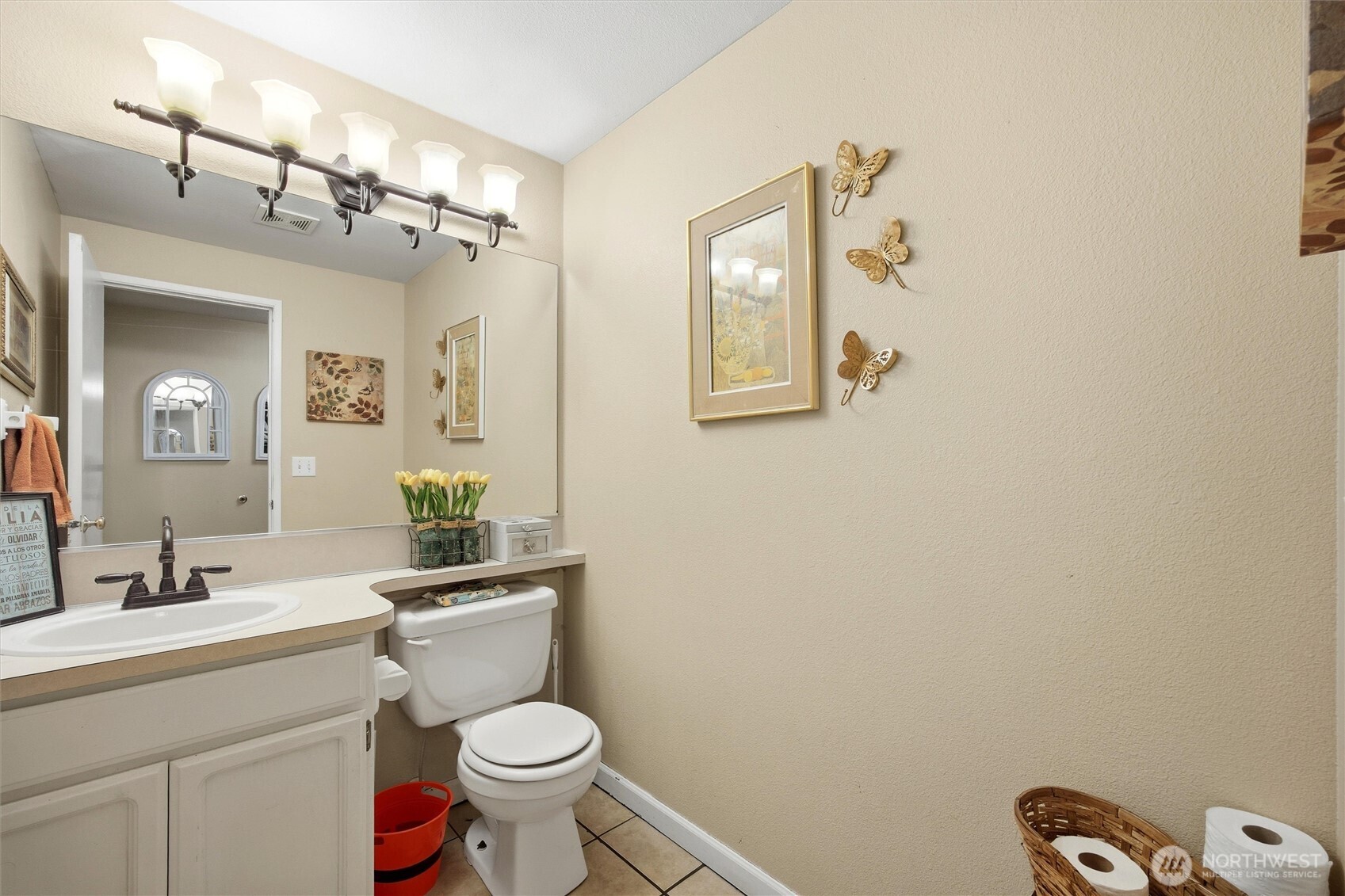 5008 Polo Lane Pasco, WA 99301 - Photo 9 of 26 a bathroom with a toilet sink vanity and mirror