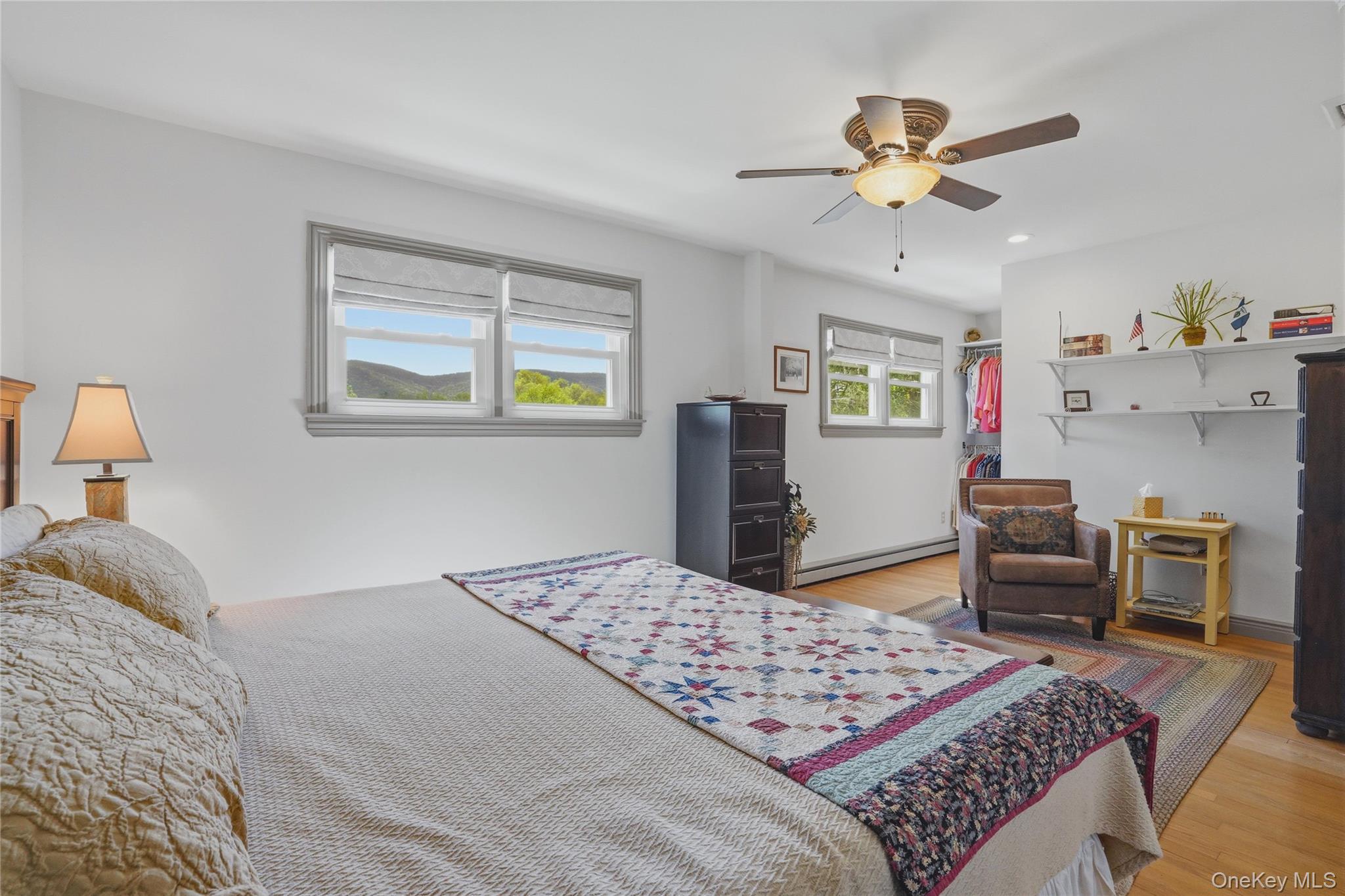 6 Willow Lane Fishkill, NY 12524 - Photo 14 of 33 a bedroom with a bed and a chandelier
