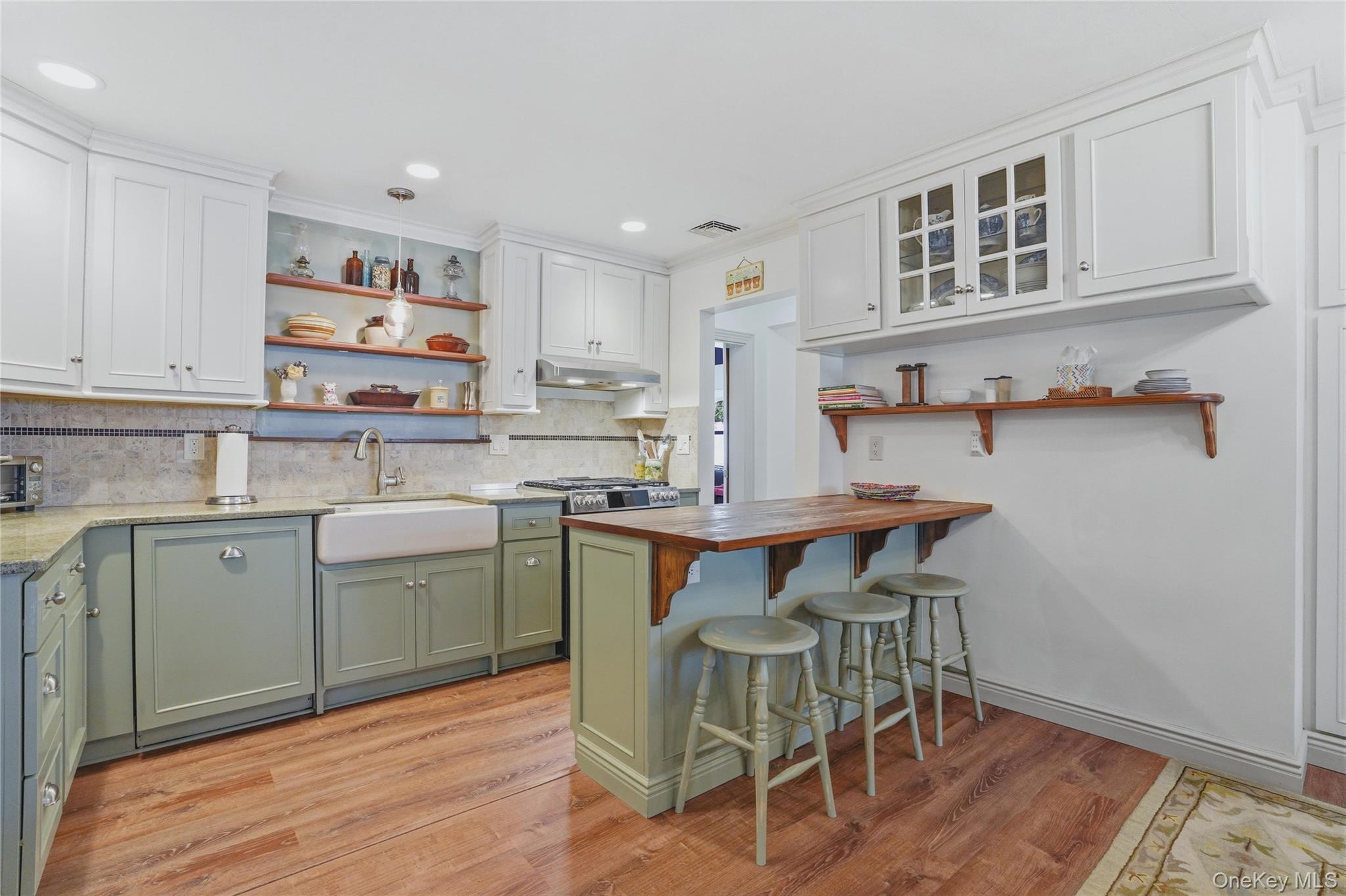 6 Willow Lane Fishkill, NY 12524 - Photo 2 of 33 a kitchen with a sink cabinets and wooden floor