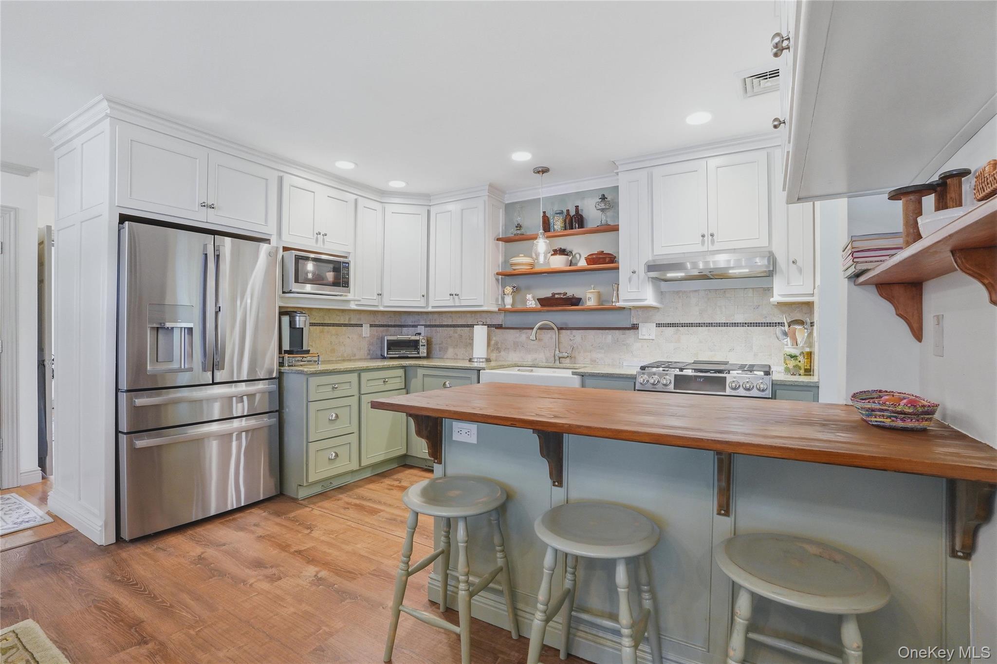 6 Willow Lane Fishkill, NY 12524 - Photo 3 of 33 a kitchen with stainless steel appliances a sink a stove a refrigerator and cabinets