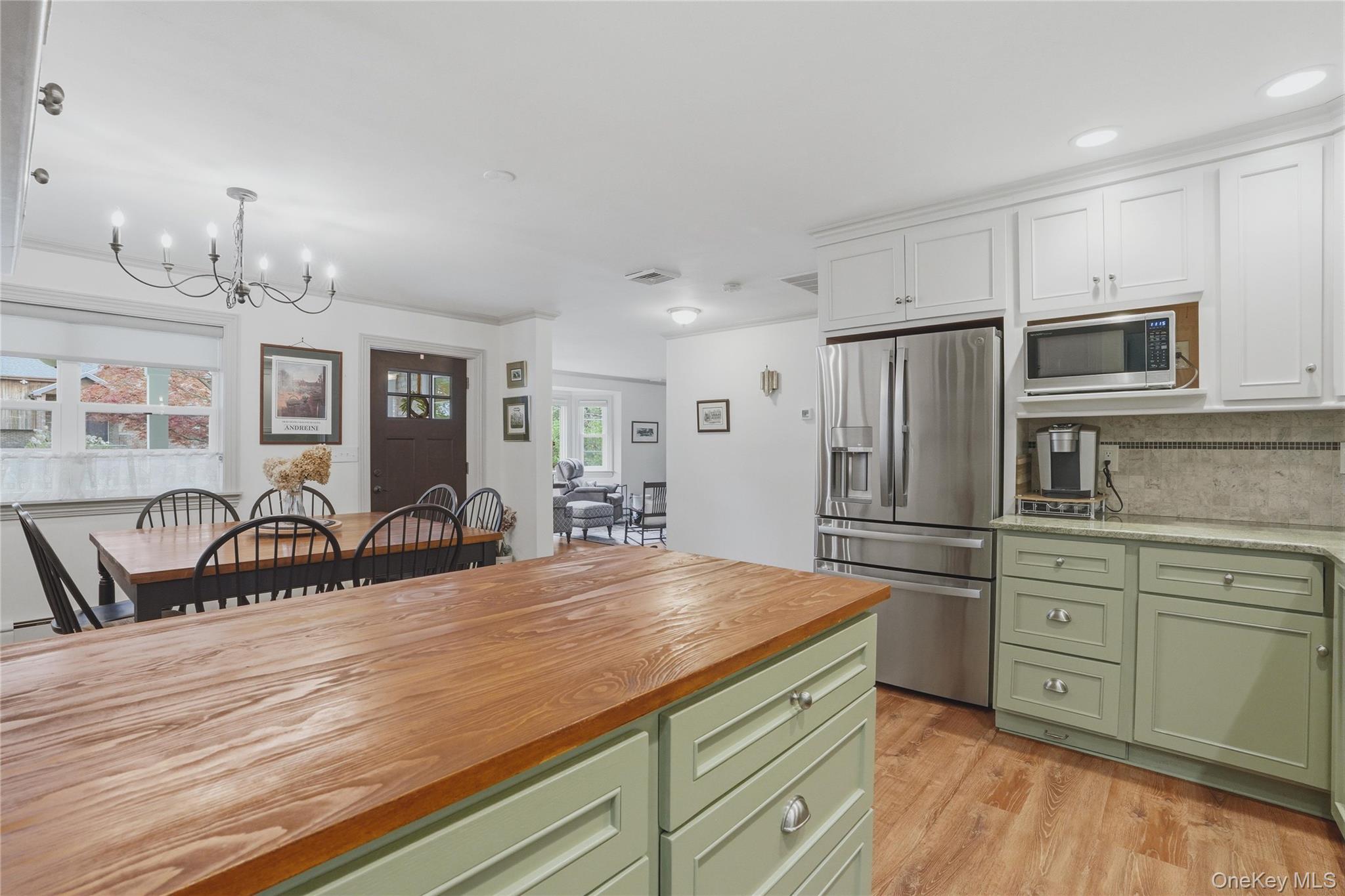 6 Willow Lane Fishkill, NY 12524 - Photo 6 of 33 a kitchen with refrigerator cabinets and wooden floor