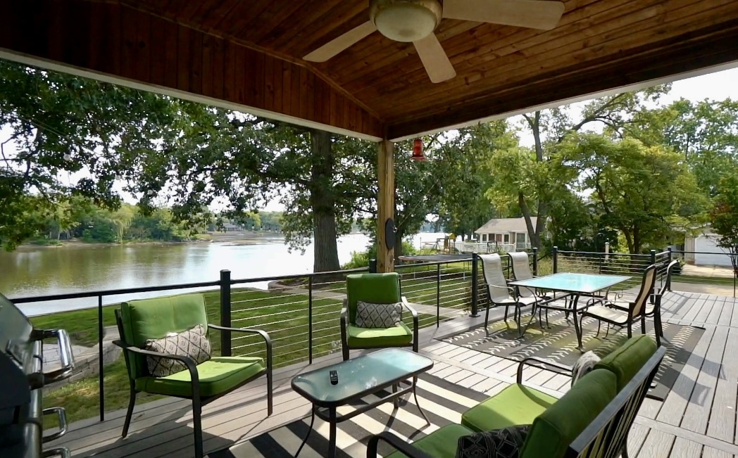 2611 2560 River Road Kankakee, IL 60901 - Photo 11 of 53 a view of a chairs and table in patio with a lake view