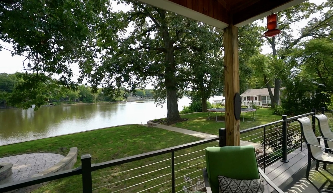 2611 2560 River Road Kankakee, IL 60901 - Photo 12 of 53 a view of a deck with a table and chairs next to a yard
