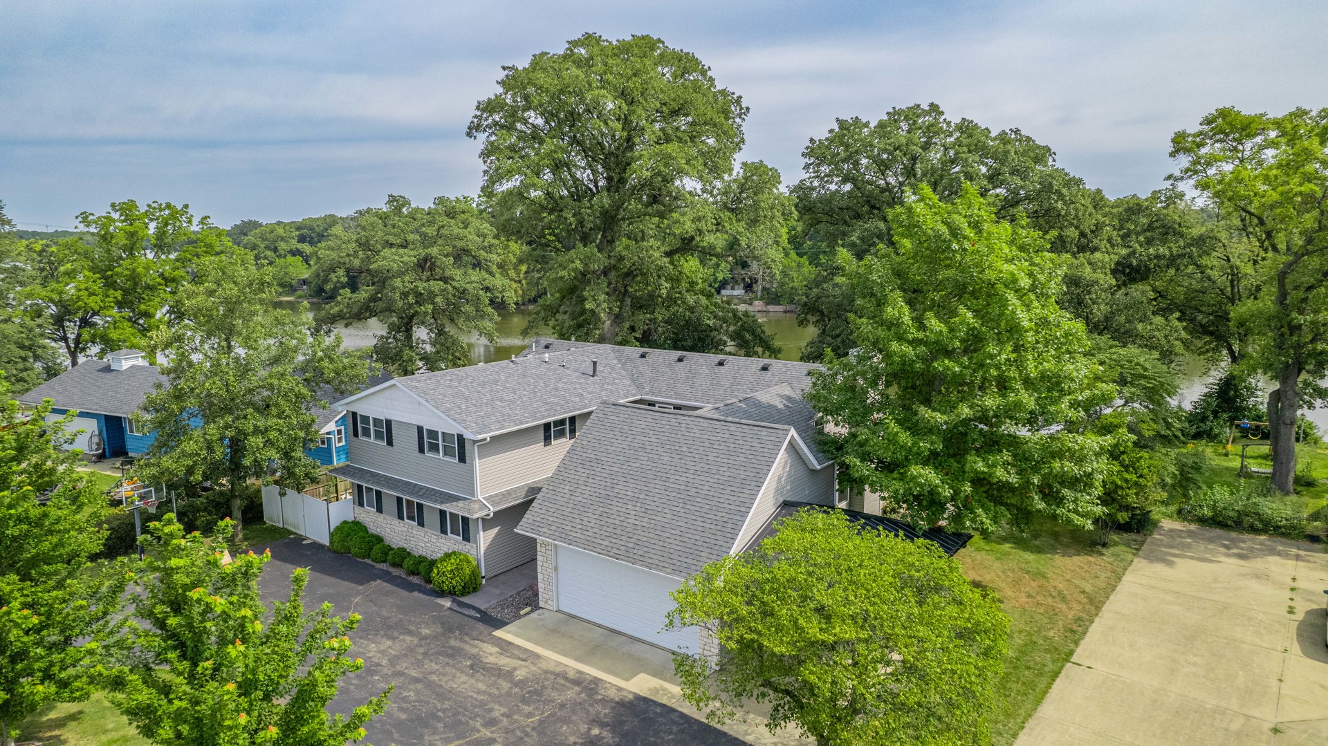 2611 2560 River Road Kankakee, IL 60901 - Photo 14 of 53 an aerial view of a house with a yard and large trees