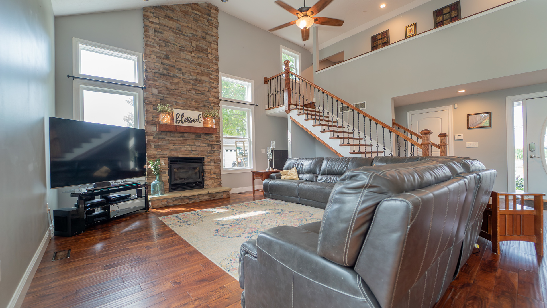 2611 2560 River Road Kankakee, IL 60901 - Photo 16 of 53 a living room with furniture flat screen tv and a fireplace