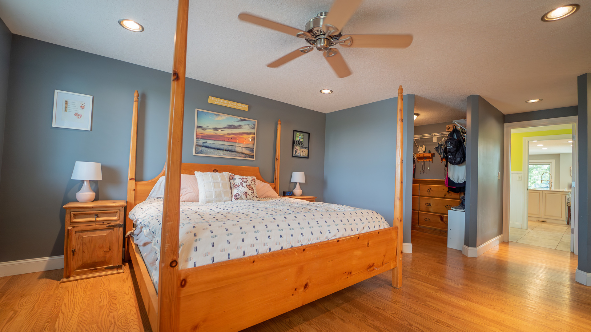 2611 2560 River Road Kankakee, IL 60901 - Photo 34 of 53 a bedroom with a large bed and a chandelier