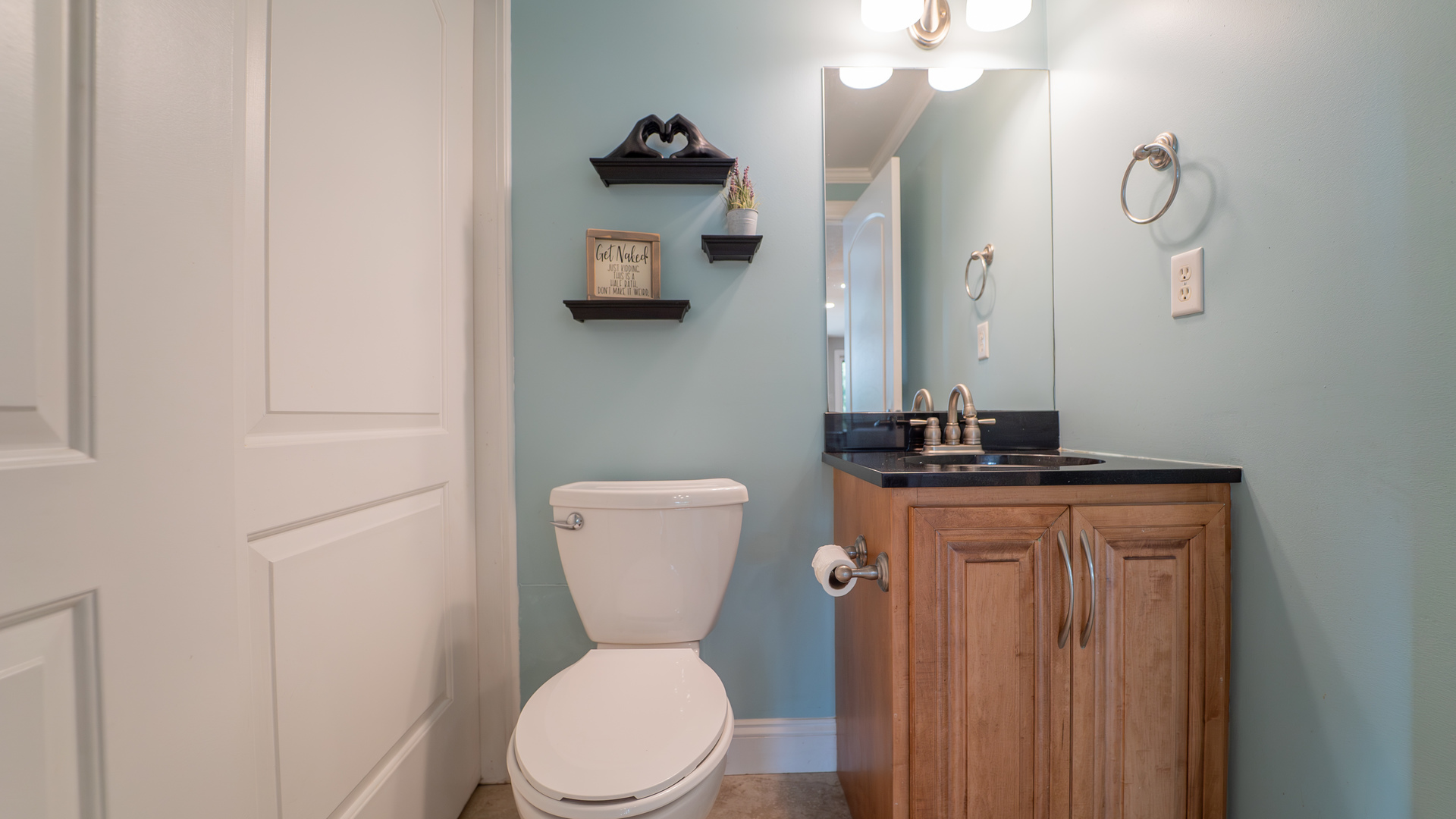 2611 2560 River Road Kankakee, IL 60901 - Photo 42 of 53 a bathroom with a toilet a sink and mirror