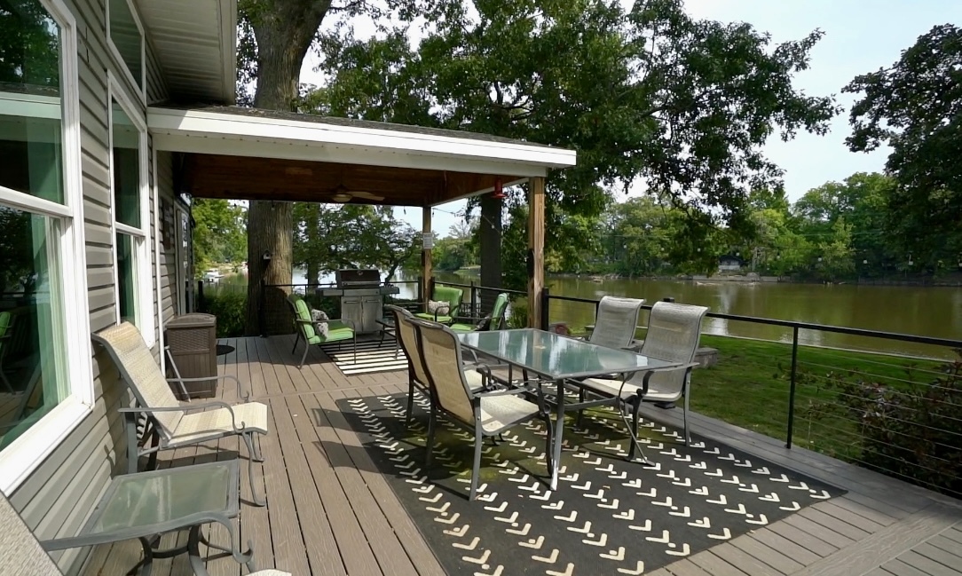 2611 2560 River Road Kankakee, IL 60901 - Photo 10 of 53 a view of a patio with table and chairs potted plants with wooden floor and floor to ceiling window