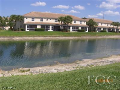 11729 Eros Road Lehigh Acres, FL 33971 - Photo 3 of 10 a view of a big yard next to a house