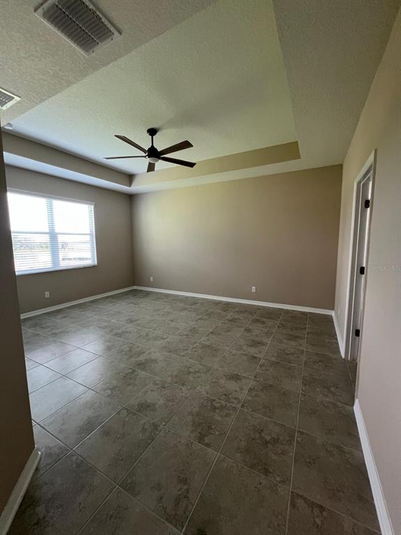 9429 Crescent Ray Drive Wesley Chapel, FL 33545 - Photo 9 of 40 a view of an empty room with a window