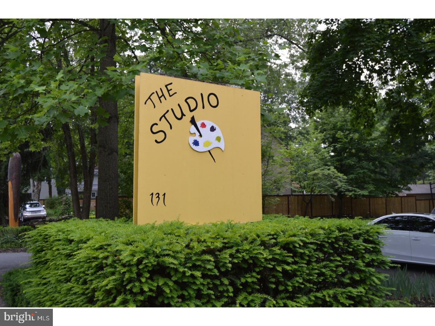 131 North Main Street New Hope, PA 18938 - Photo 21 of 26 a sign that is on a brick wall with a white fence