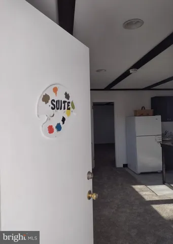 a view of storage and utility room with a window