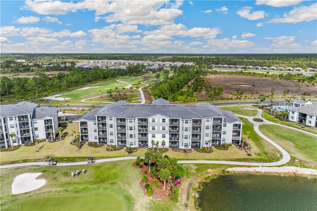 43977 Boardwalk Loop, Unit 2315 Babcock Ranch, FL 33982 - Photo 15 of 15 a view of a swimming pool with a lake view