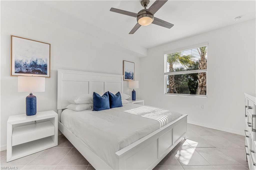43977 Boardwalk Loop, Unit 2315 Babcock Ranch, FL 33982 - Photo 8 of 15 a bedroom with a large bed and a window