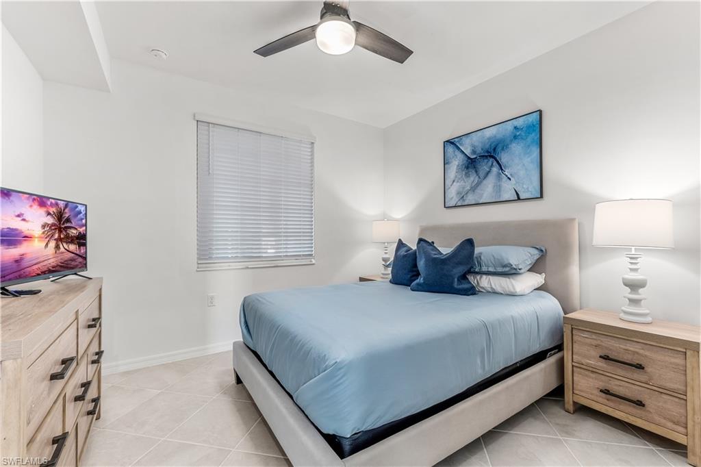 43977 Boardwalk Loop, Unit 2315 Babcock Ranch, FL 33982 - Photo 10 of 15 a bedroom with a bed and a flat screen tv