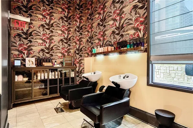 a view of a balcony with couch and chandelier