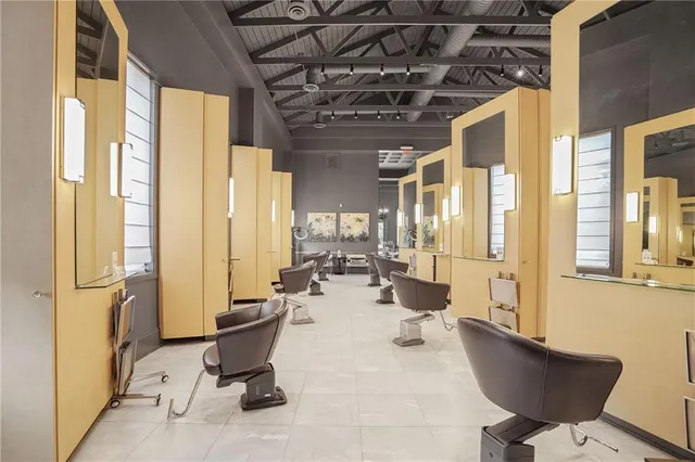 a view of a livingroom with furniture and a window