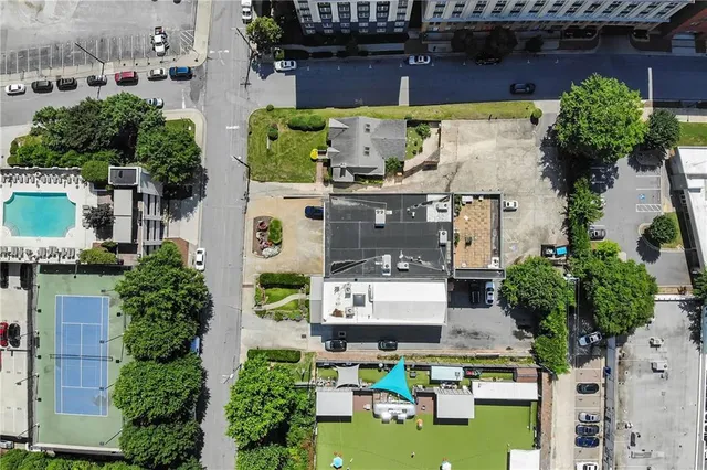 a aerial view of a house with garden space and street view