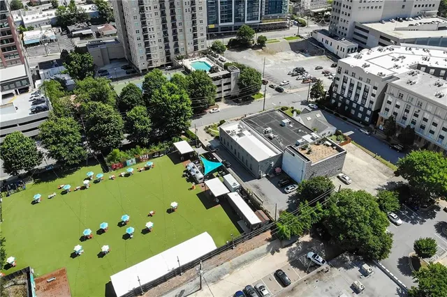 an aerial view of a residential houses with outdoor space