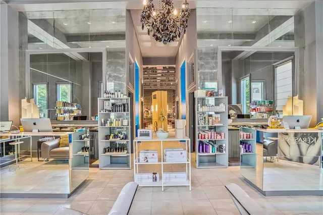 a living room with lots of furniture and white walls