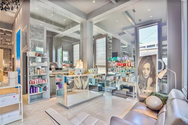 a living room with lots of furniture and a wooden floor