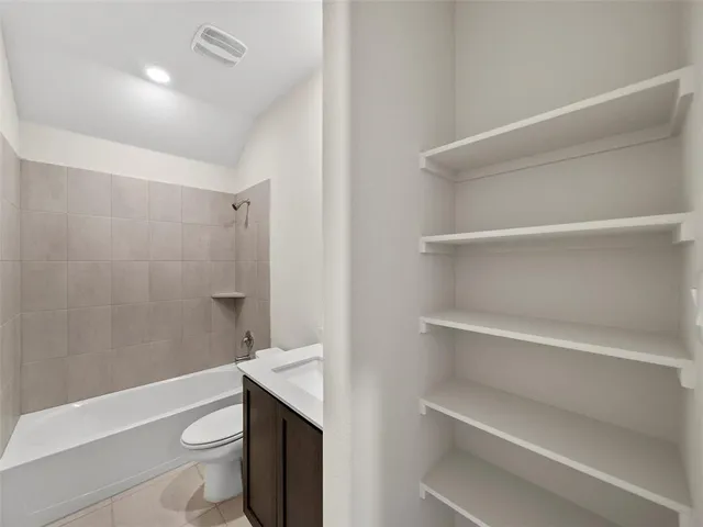a bathroom with a sink toilet and bathtub