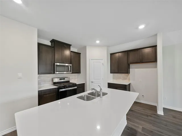 a bathroom with a double vanity sink mirror and