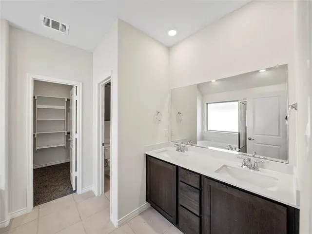 a bathroom with a bathtub and a sink