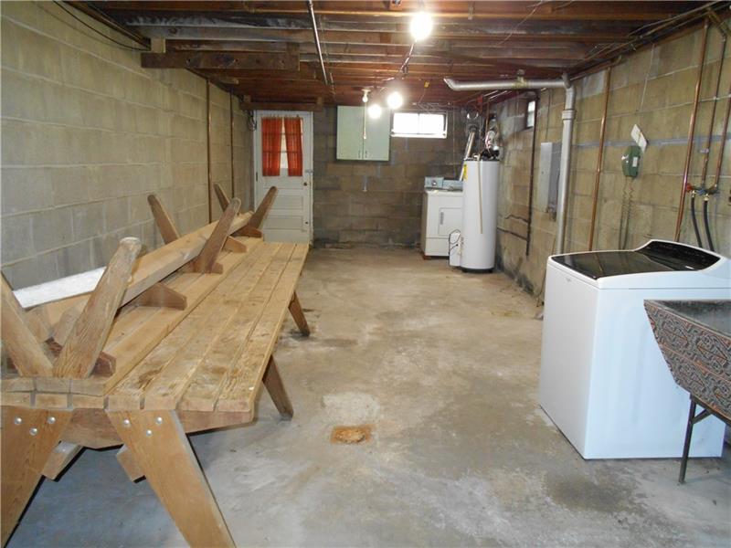 743 Braddock Road Pittsburgh, PA 15221 - Photo 23 of 25 Large basement has so much room for storage or as a work room. Just add your pegboards and bring your tool box.