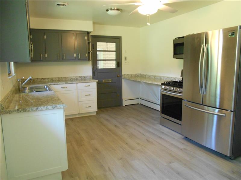 743 Braddock Road Pittsburgh, PA 15221 - Photo 9 of 25 Spacious eat in kitchen has new stainless steel appliances and many other updates.