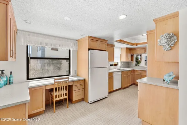 a spacious bedroom with a bed and a couch