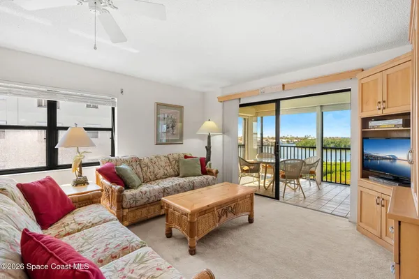 a view of swimming pool with outdoor seating