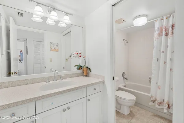 a kitchen with a sink cabinets and window