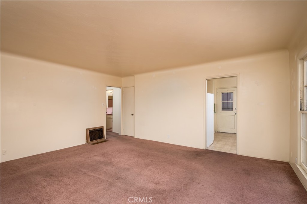 12817 Beverly Boulevard Whittier, CA 90601 - Photo 20 of 30 a view of an empty room with a kitchen