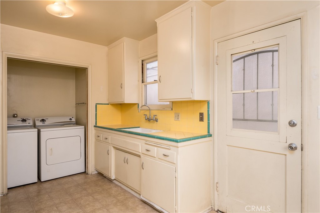 12817 Beverly Boulevard Whittier, CA 90601 - Photo 22 of 30 a kitchen with a sink and cabinets